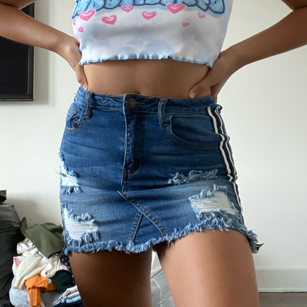 Ripped denim skirt with striped sides